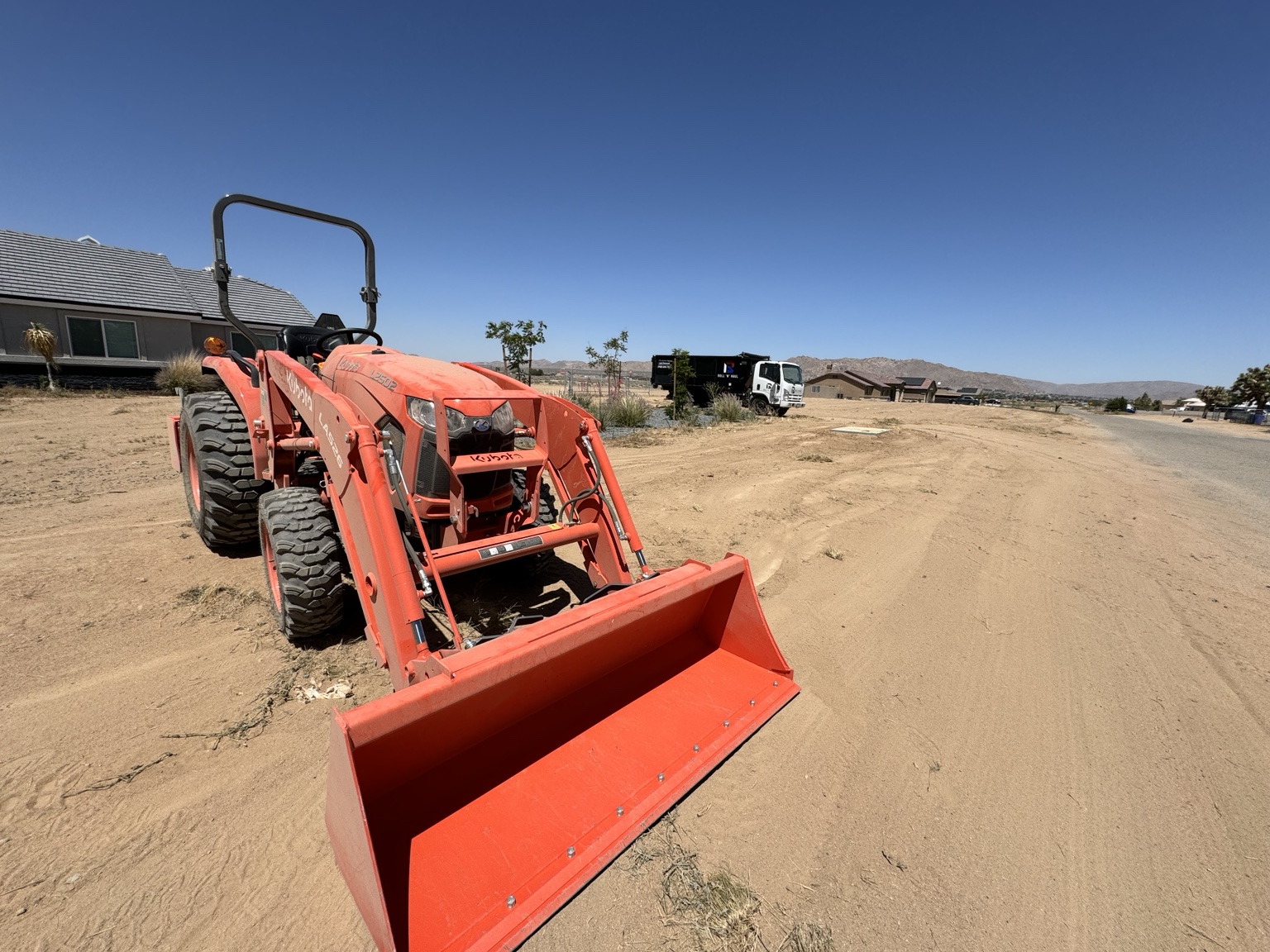 Kubota tractor used for property grading